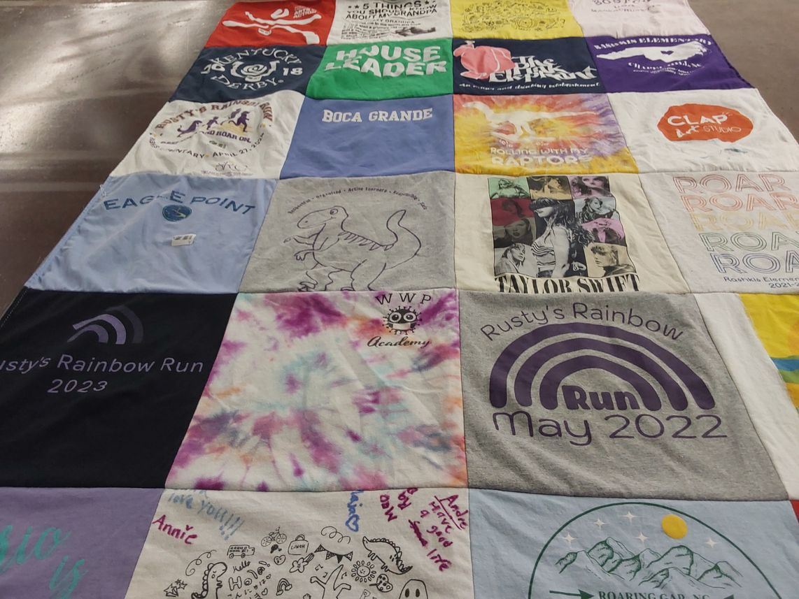 T-shirt quilt with running, events themes by Julie from NC