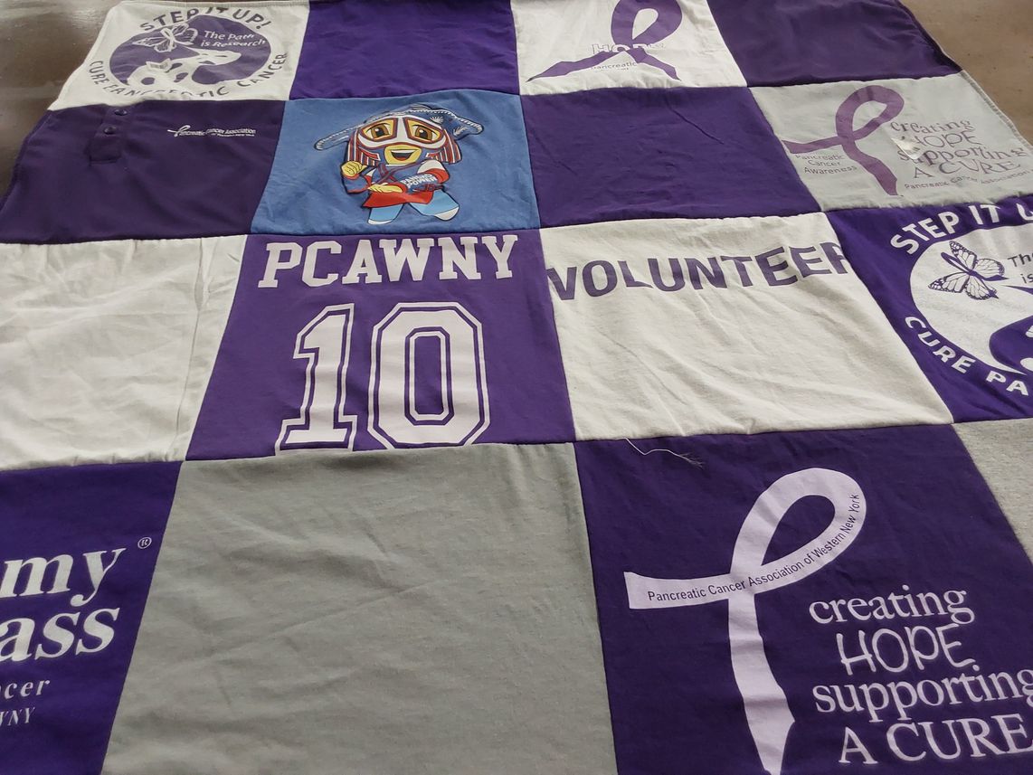T-shirt quilt with pancreatic cancer awareness, volunteering themes by MaryEllen from NY