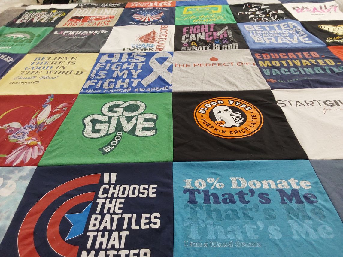 T-shirt quilt with blood donation, cancer awareness themes by Rachel from FL