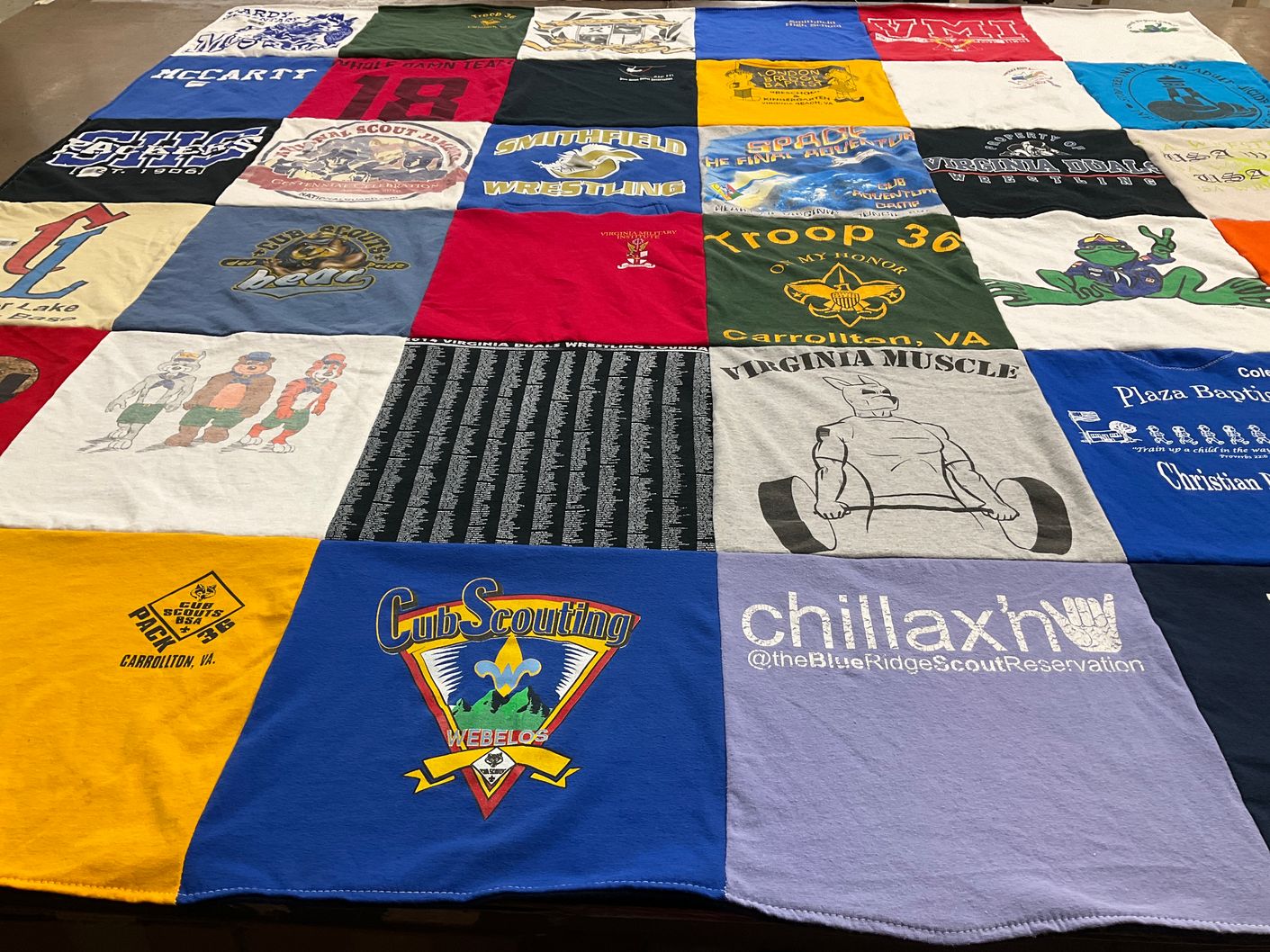T-shirt quilt with scouting, wrestling themes by Paula from VA