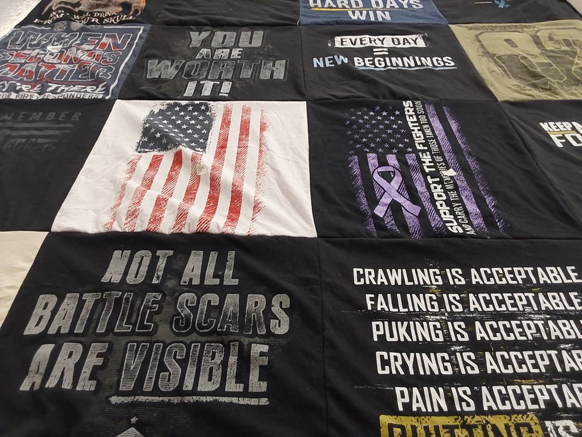 T-shirt quilt with motivational, support themes by Colleen from MO