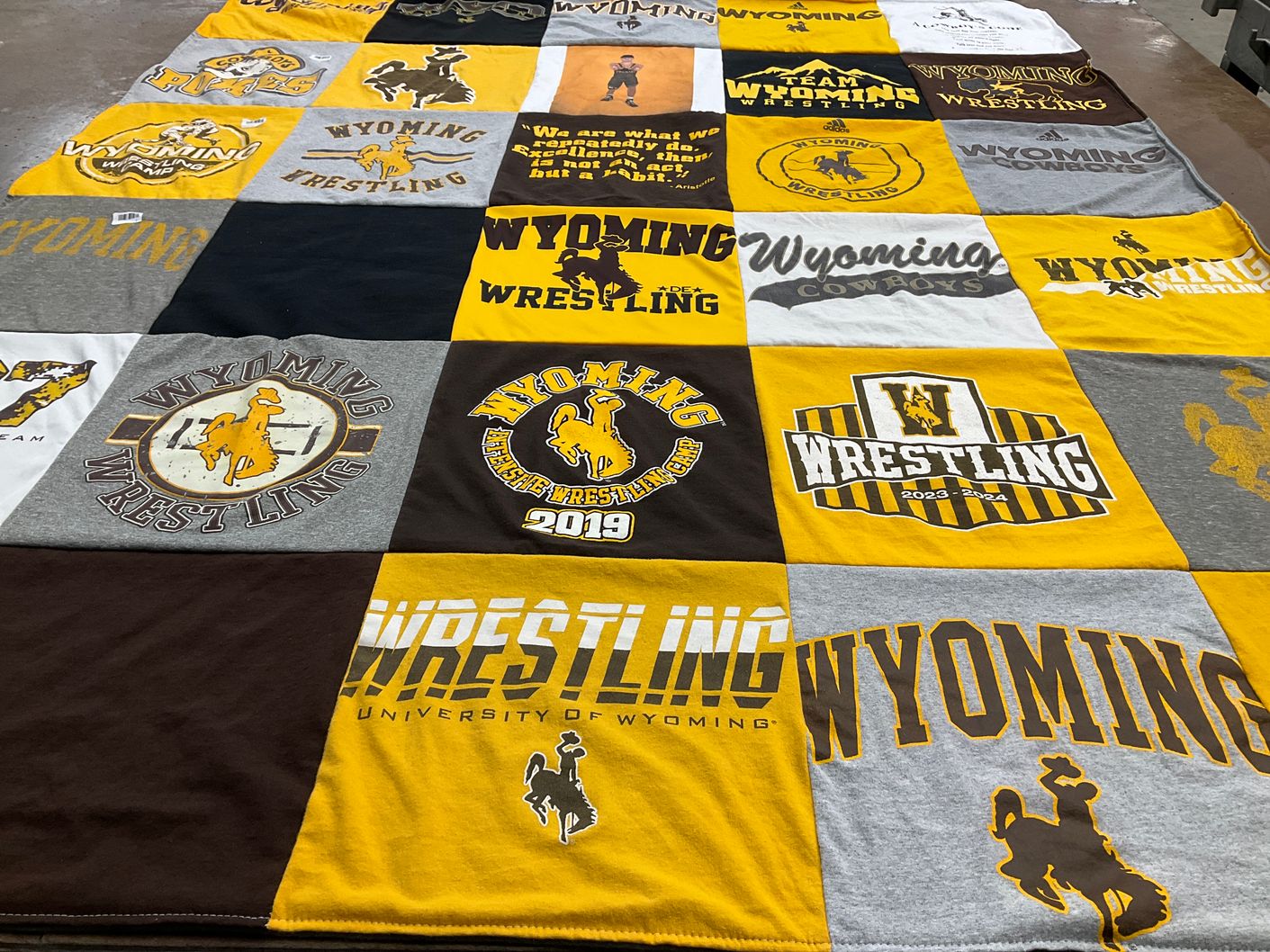 T-shirt quilt featuring wyoming cowboys wrestling by Janelle from WY