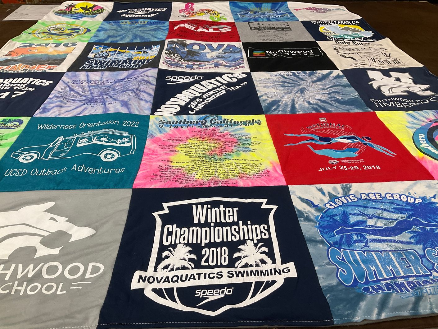 T-shirt quilt featuring novaquatics swimming, sportwood timberwolves by Maricris from CA