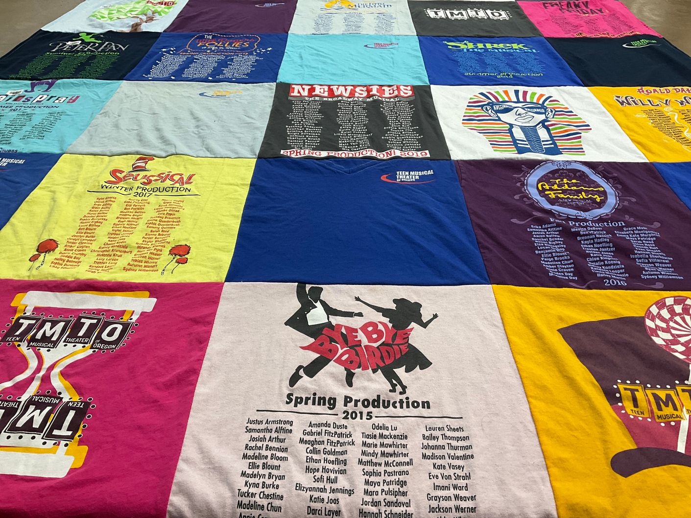 T-shirt quilt with theater, musicals themes by Grayson from CA