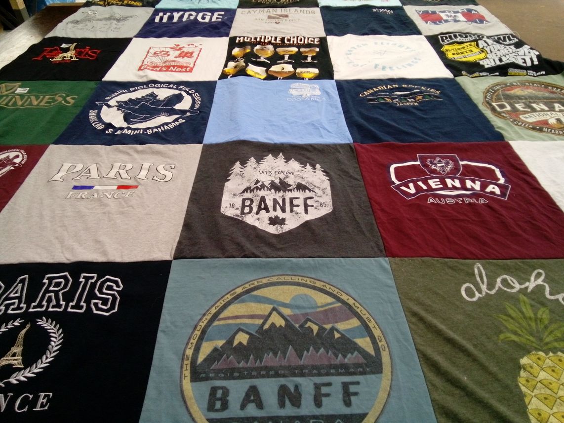 T-shirt quilt with travel, hiking themes by Sydney from IN