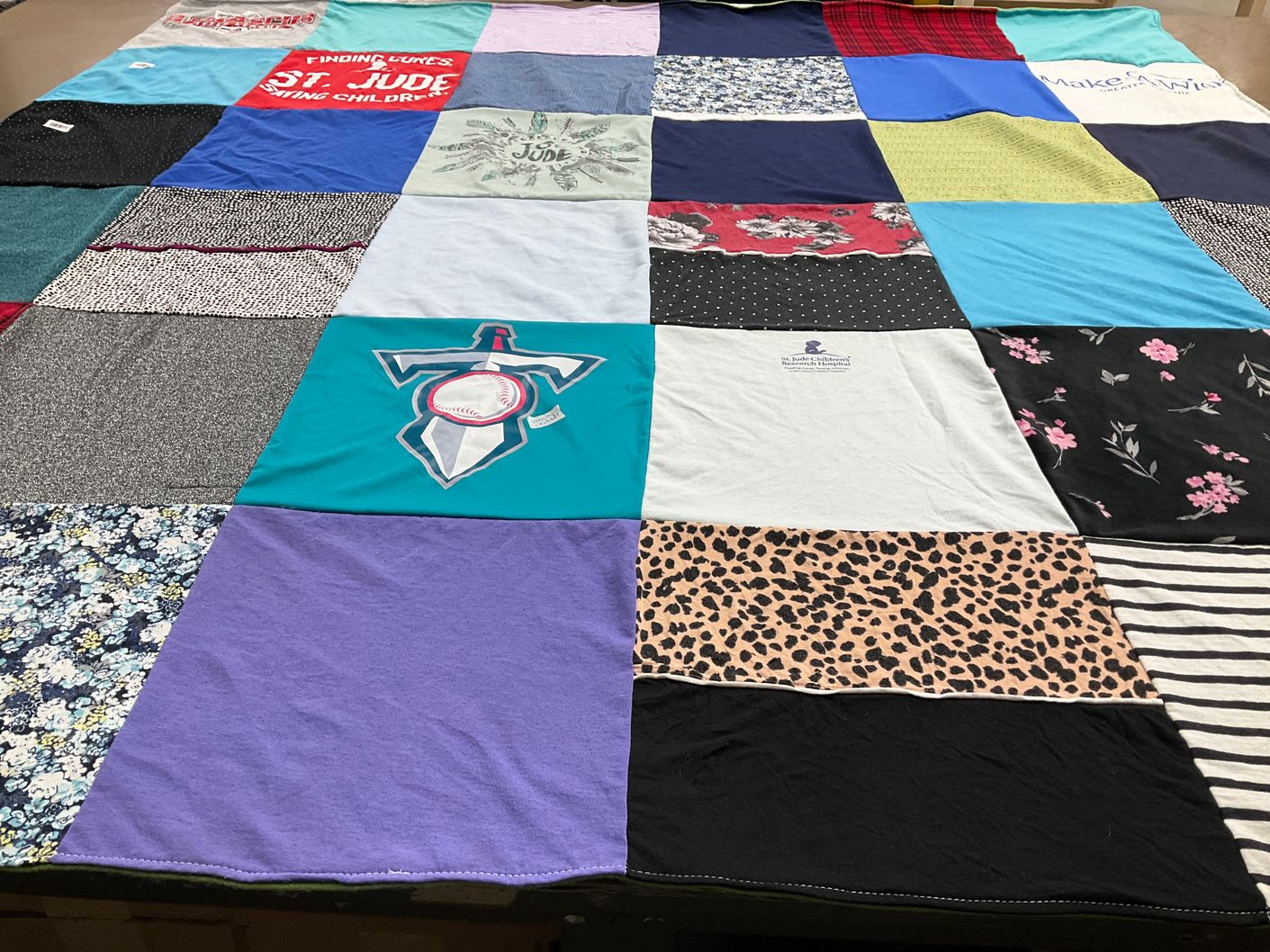 T-shirt quilt with charity, fundraising themes by Kelley from VA
