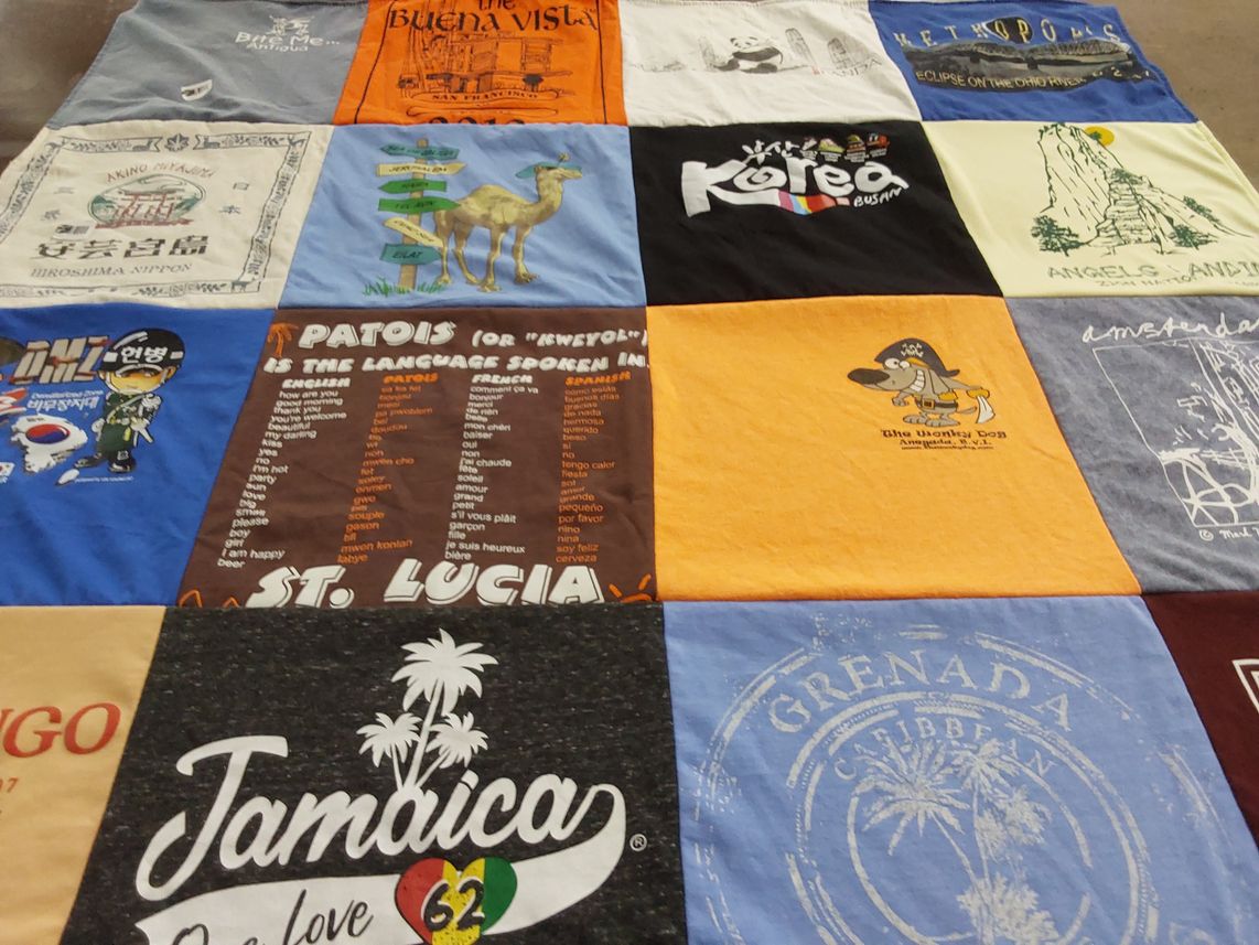 T-shirt quilt with travel, languages themes by Ellyn from IL