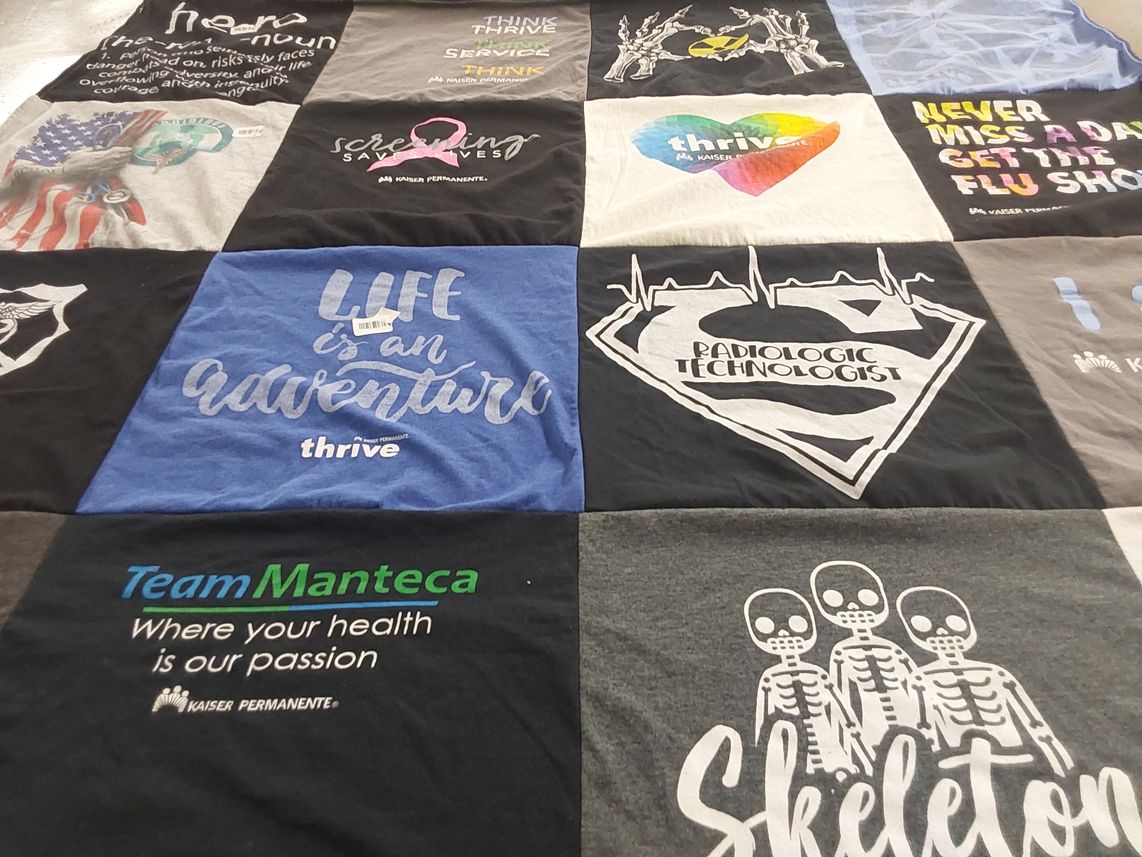 T-shirt quilt with health, wellness themes by Bernadine from CA