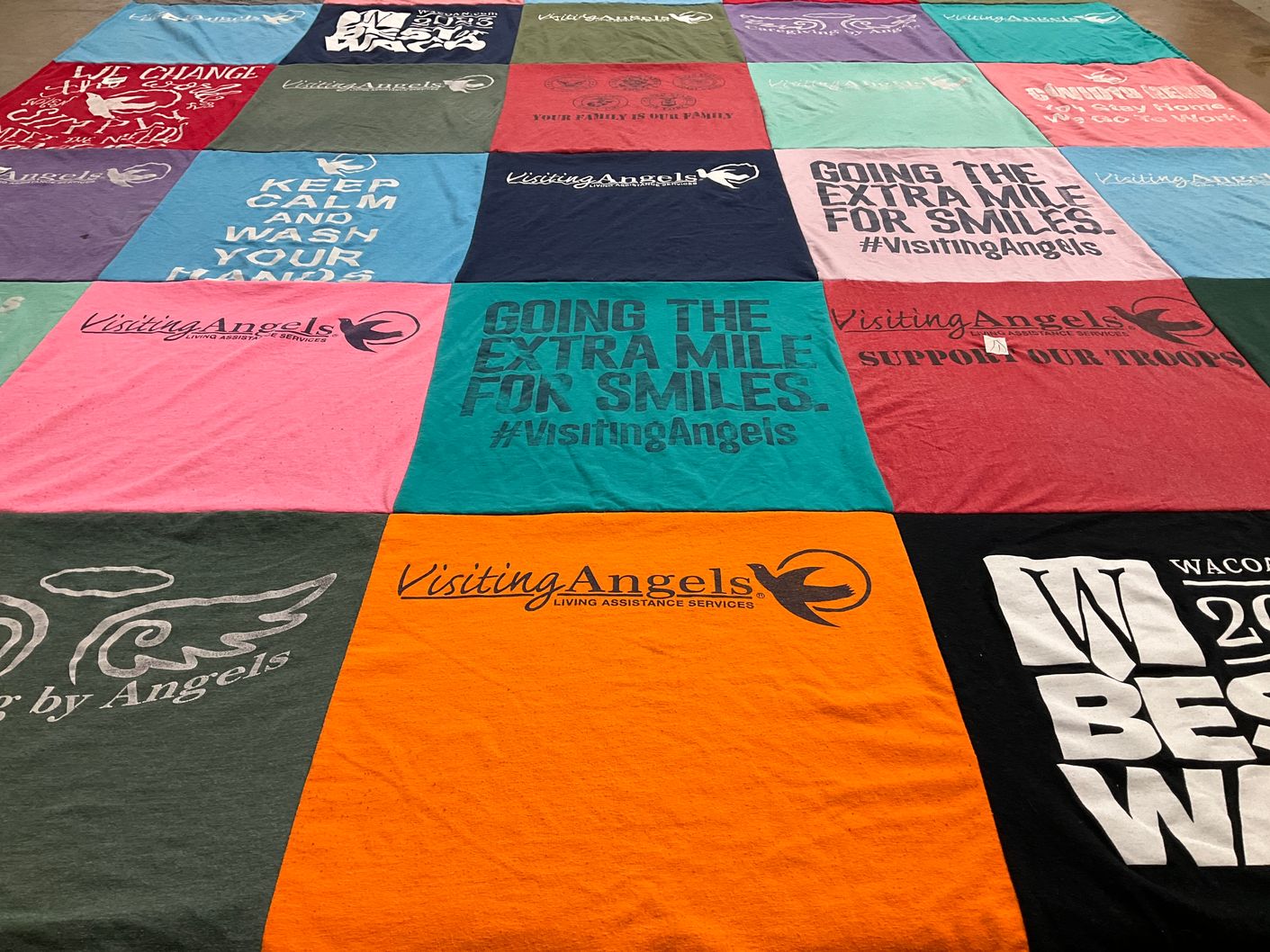 T-shirt quilt with community support, caregiving themes by Holly from TX