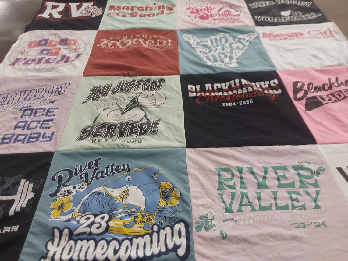 T-shirt quilt featuring blackhawks, river valley marching band by Stacy from WI