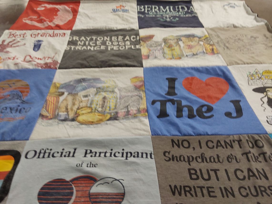 T-shirt quilt with travel, family themes by Naomi from AL