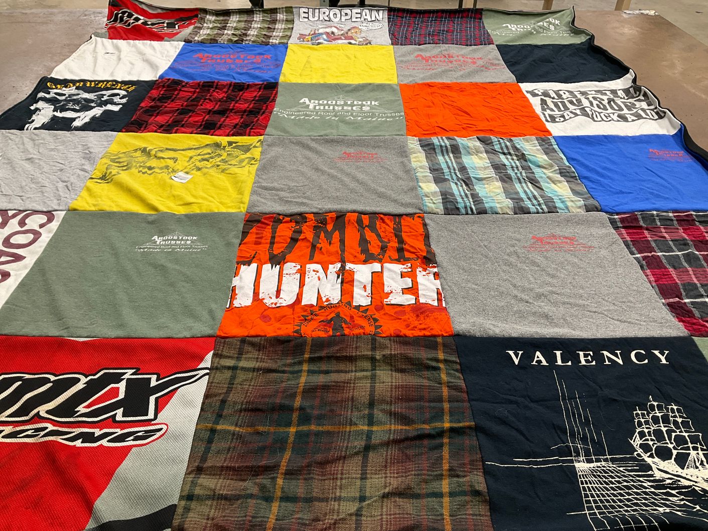 T-shirt quilt with motorsports, hunting themes by Carrie from ME