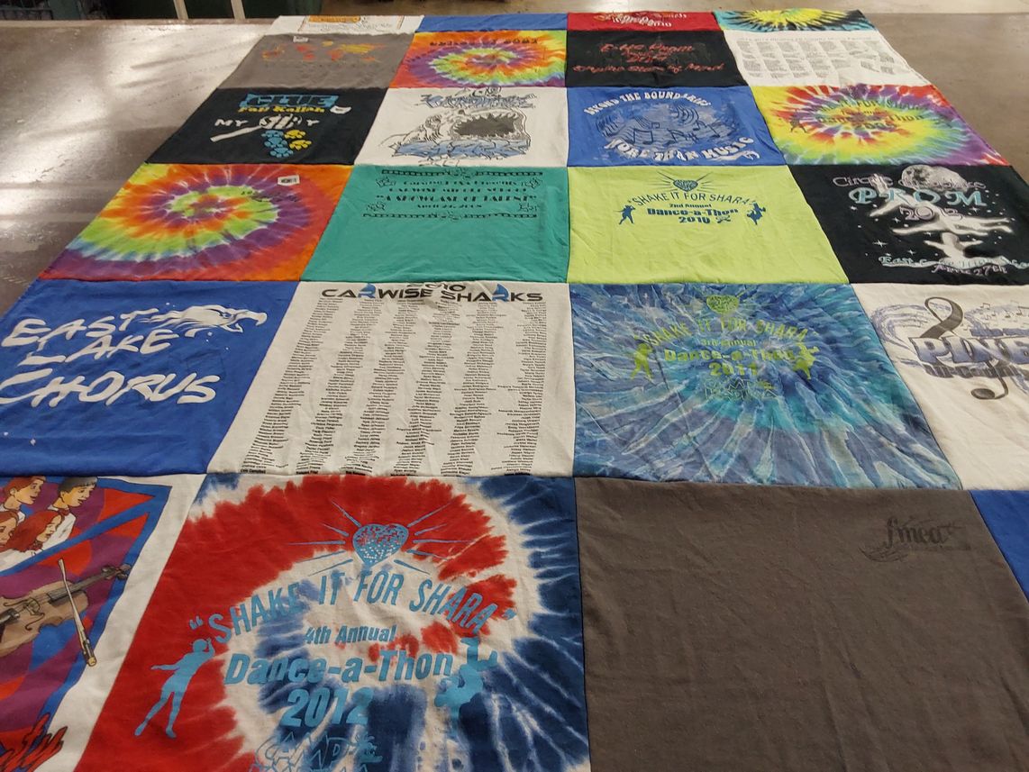 T-shirt quilt featuring carwise middle school sharks by Emily from FL