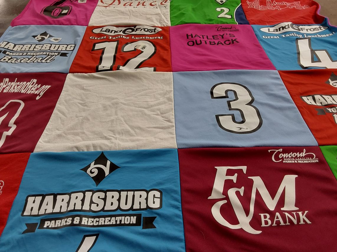 T-shirt quilt with dance, sports themes by James from NC