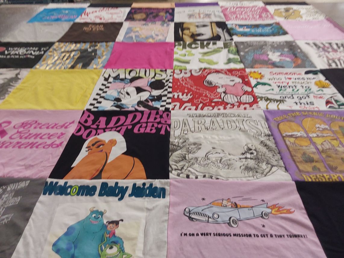 T-shirt quilt with cartoons, breast cancer awareness themes by Wyonetta from VA