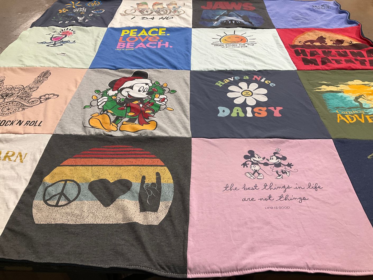 T-shirt quilt with disney, music themes by Catharine from FL