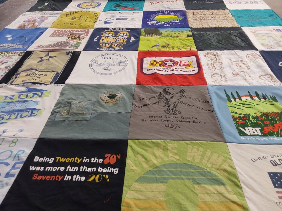 T-shirt quilt with bicycling, walking themes by Harriet from MD