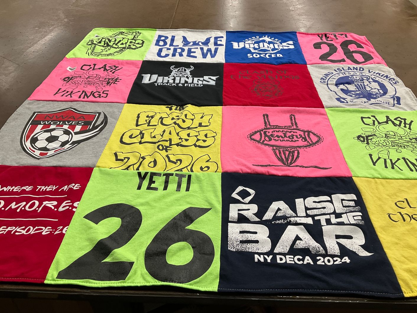 T-shirt quilt featuring grand island vikings, nwaaa wolves by Kim from NY