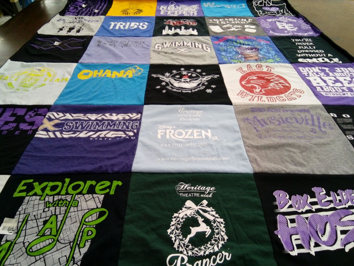 T-shirt quilt featuring swimming team by AshLee from UT