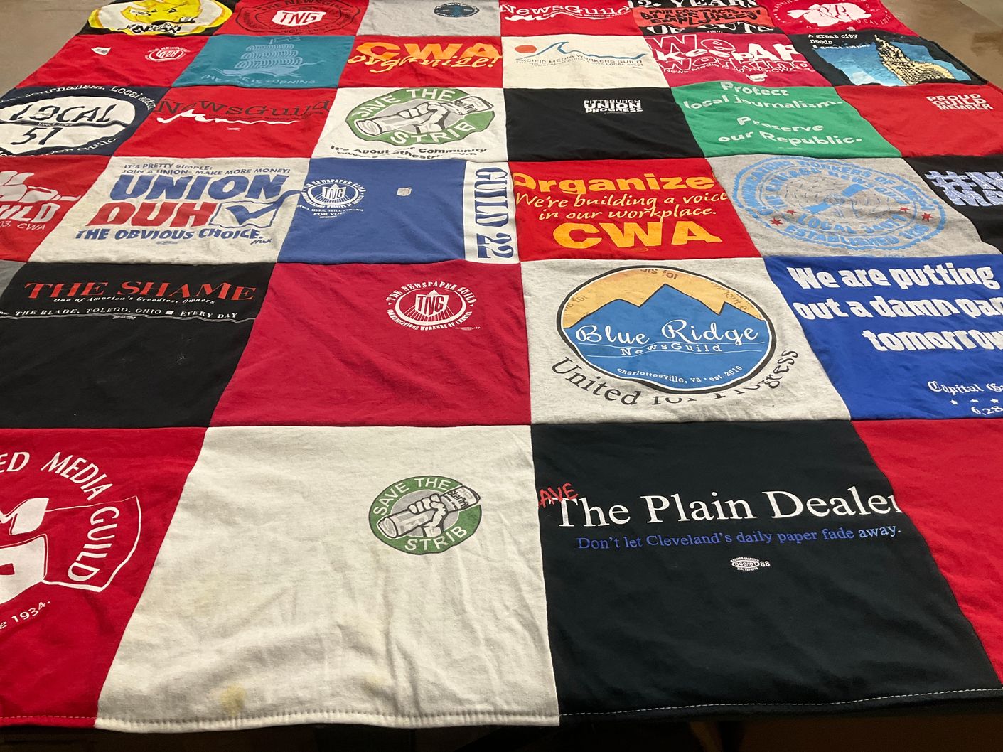 T-shirt quilt with journalism, labor rights themes by Martha from MD
