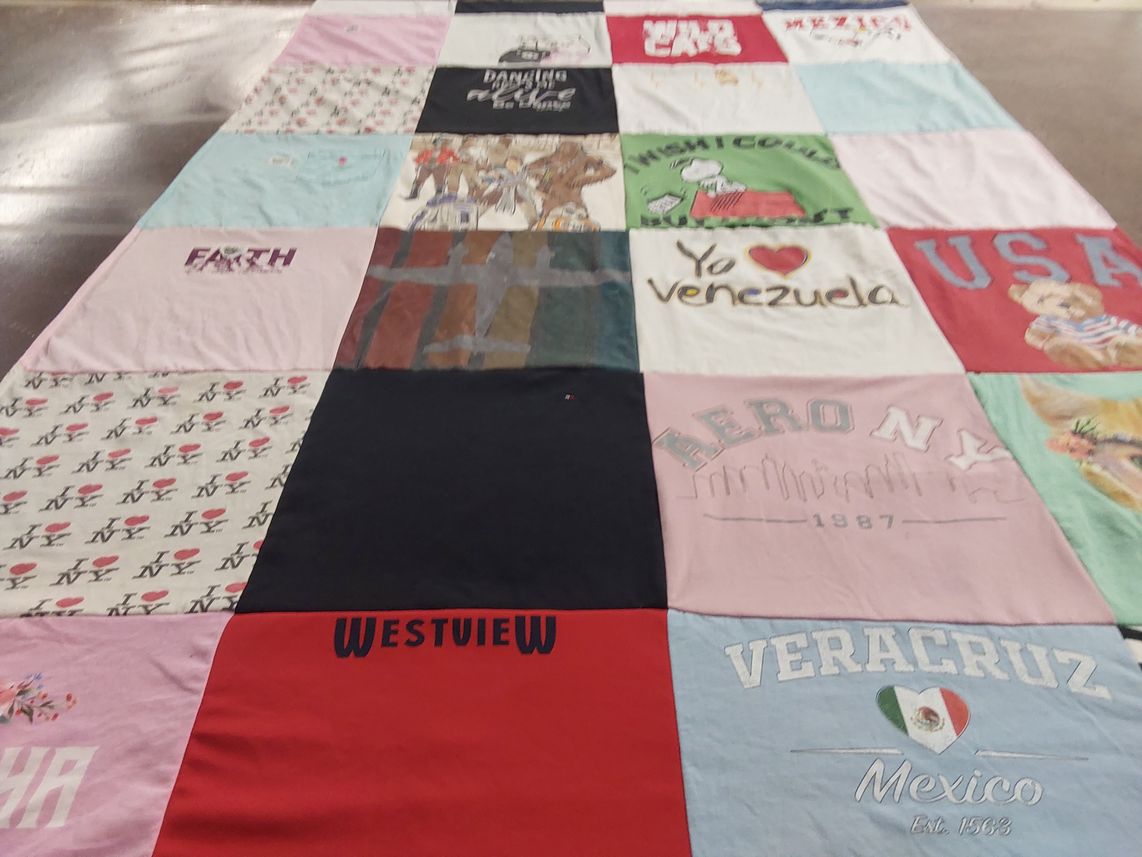 T-shirt quilt with travel, cultural heritage themes by Mariana from OR