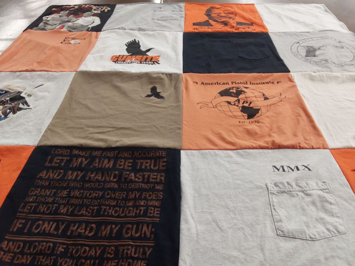 T-shirt quilt with firearms, shooting themes by Peggy from TX