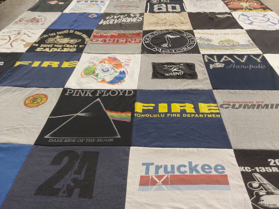 T-shirt quilt with music, firefighting themes by Lynda from HI