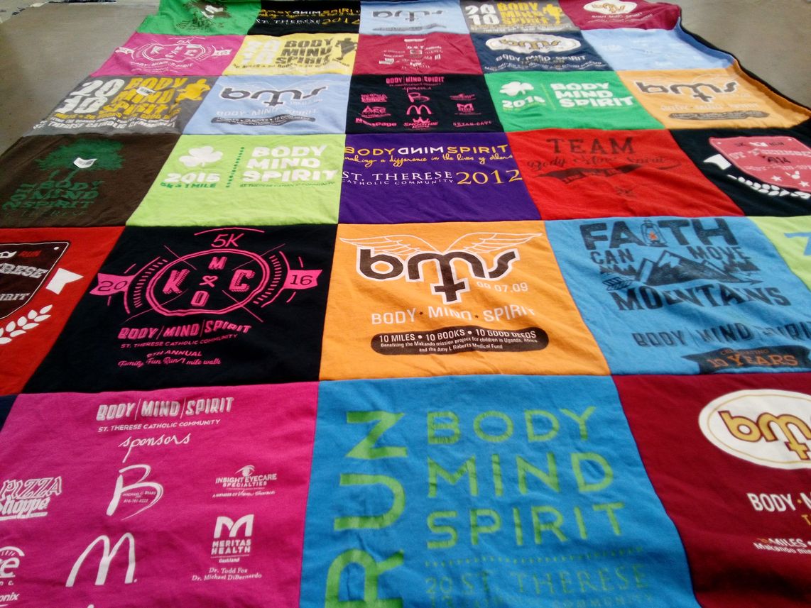 T-shirt quilt with community, running themes by Christi from MO