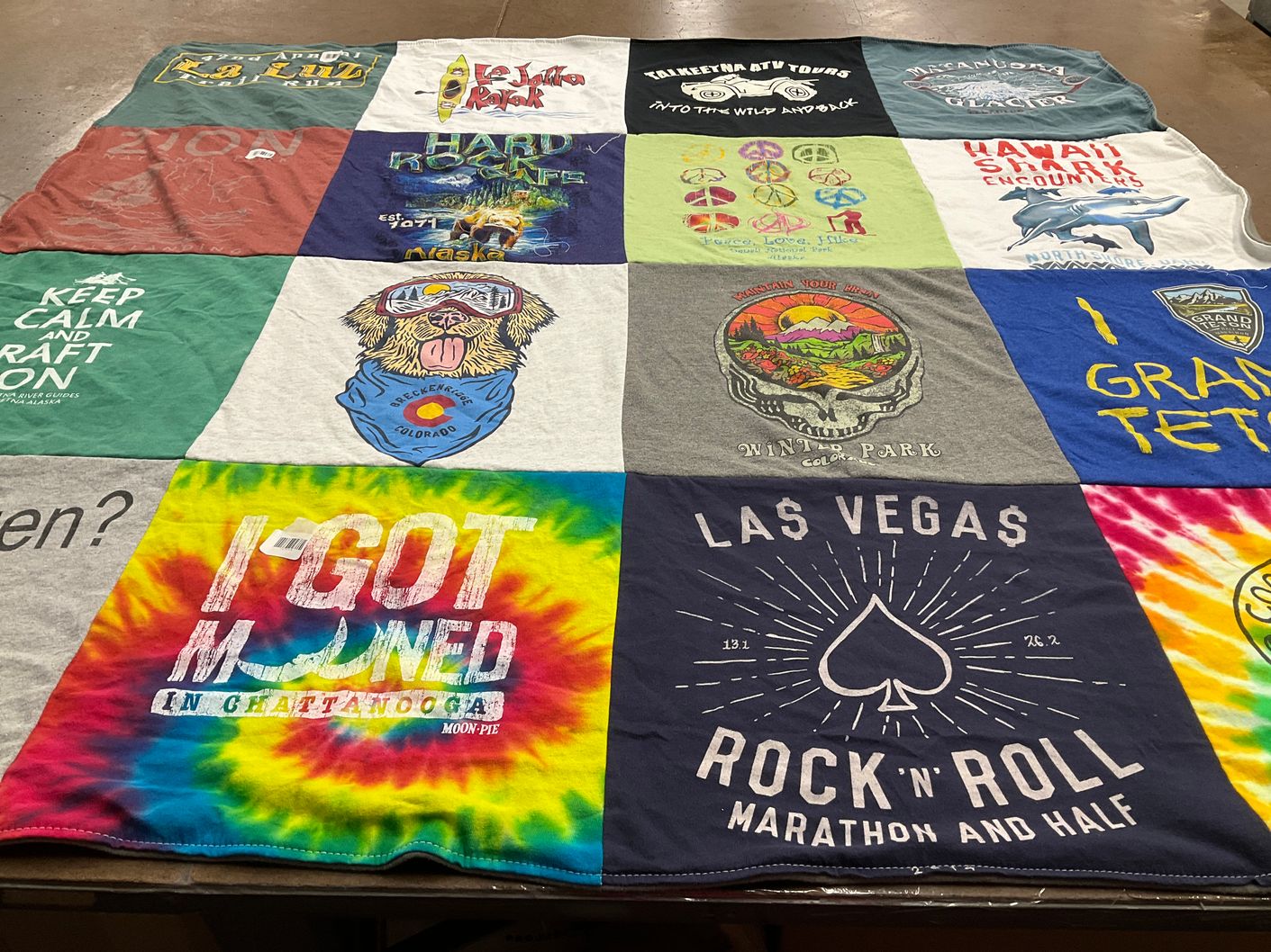 T-shirt quilt with hiking, travel themes by AnnaMarie from NM