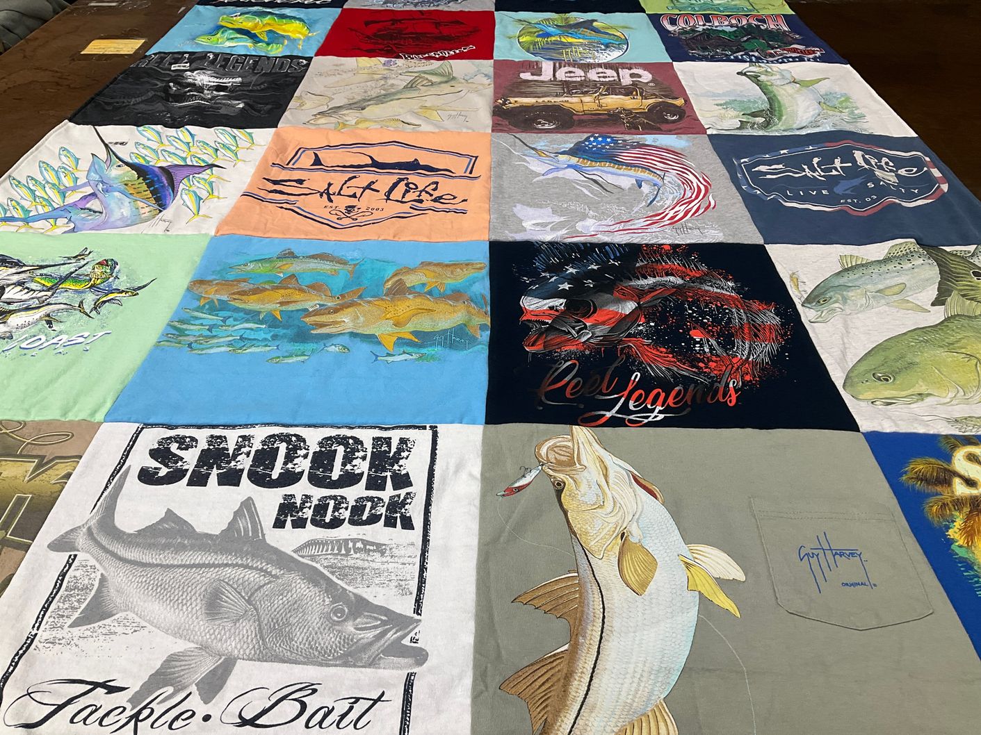 T-shirt quilt with fishing themes by Margaret from FL