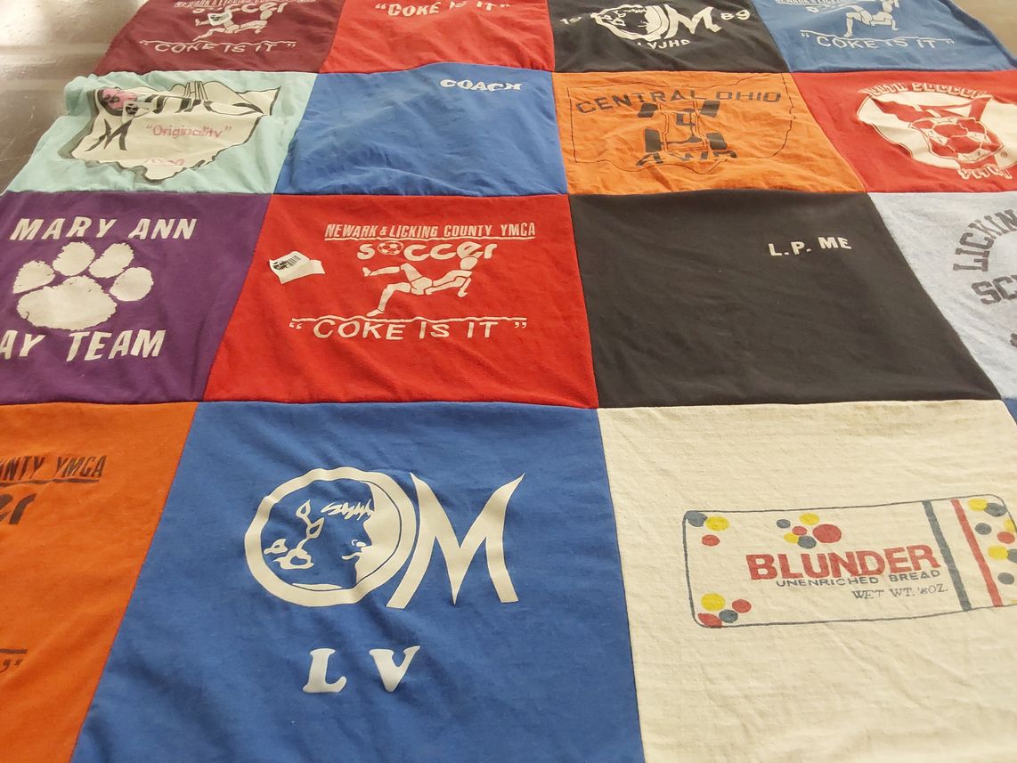 T-shirt quilt with sports, community themes by Jean from OH