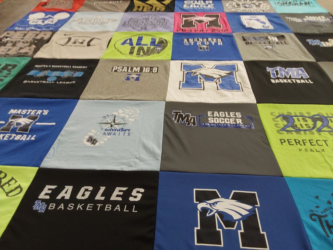 T-shirt quilt featuring the master's academy eagles basketball, the master's academy eagles soccer by Michael from FL