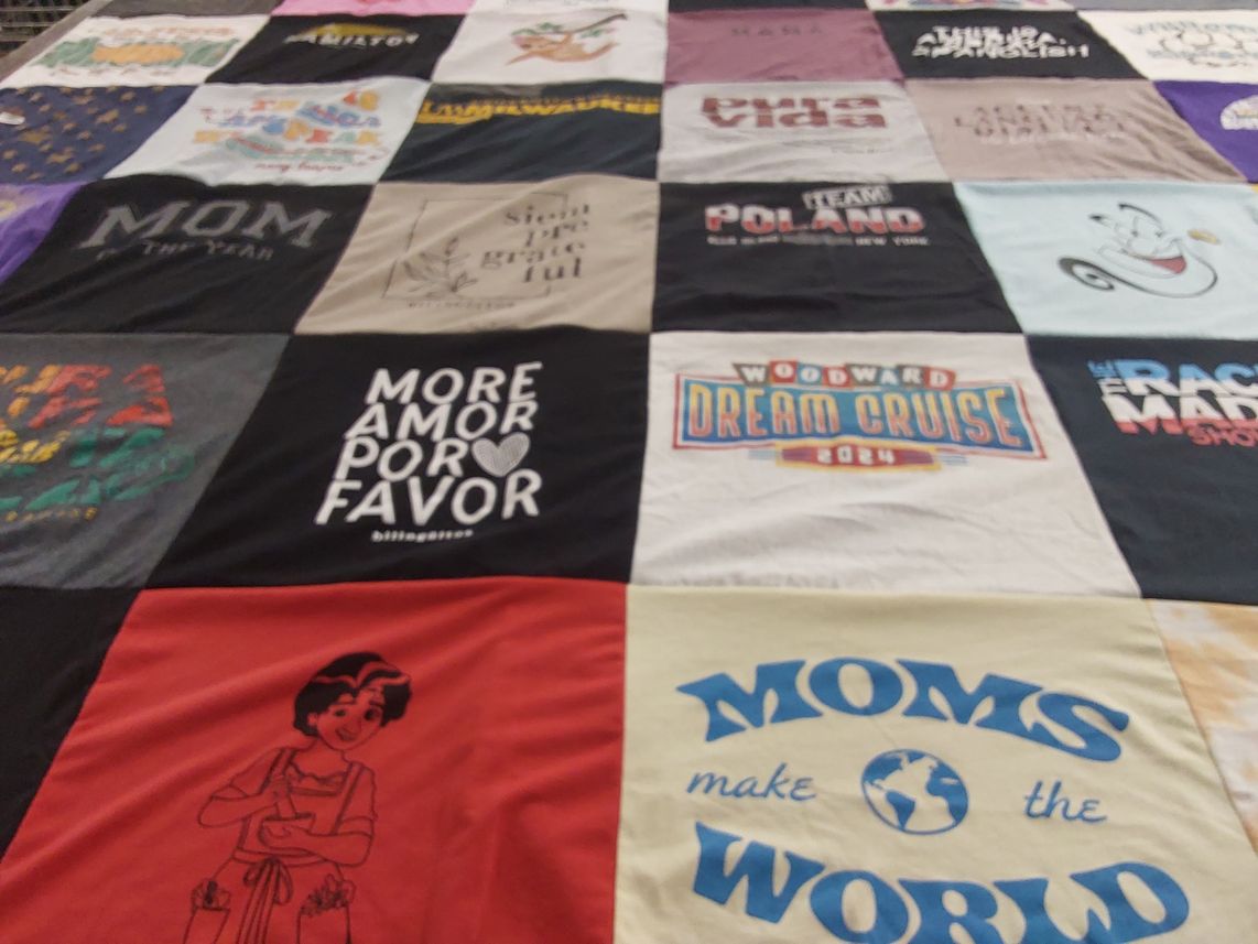 T-shirt quilt with family, travel themes by Deanna from VA