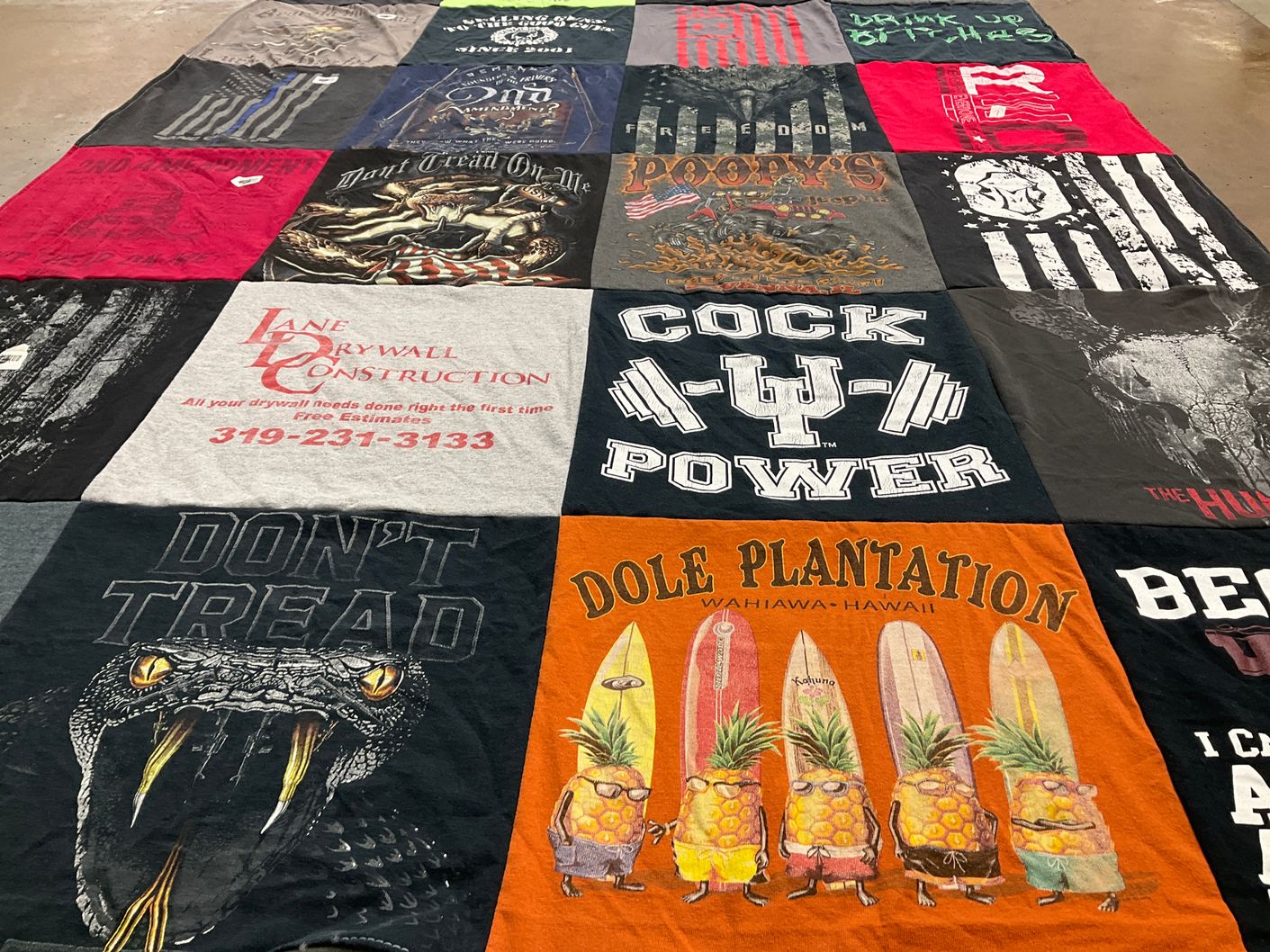 T-shirt quilt with construction, fitness themes by Michelle from IA