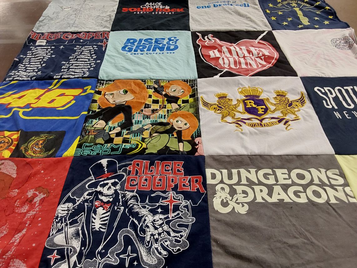 T-shirt quilt with music, comics themes by Katie from IN