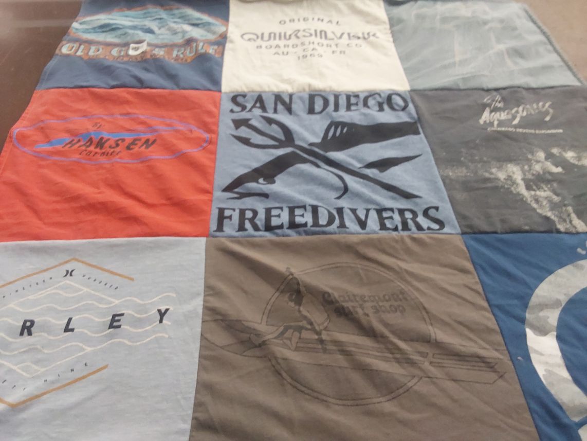 T-shirt quilt with surfing, diving themes by Redena from OK
