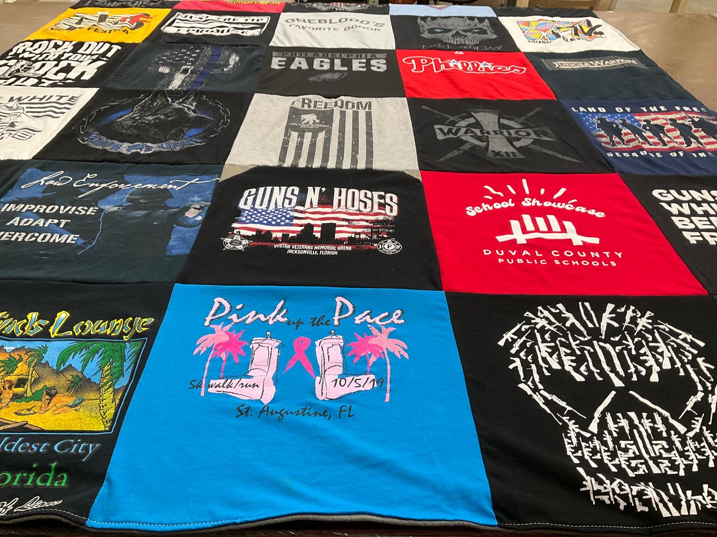 T-shirt quilt with law enforcement, community events themes by Lynda from FL