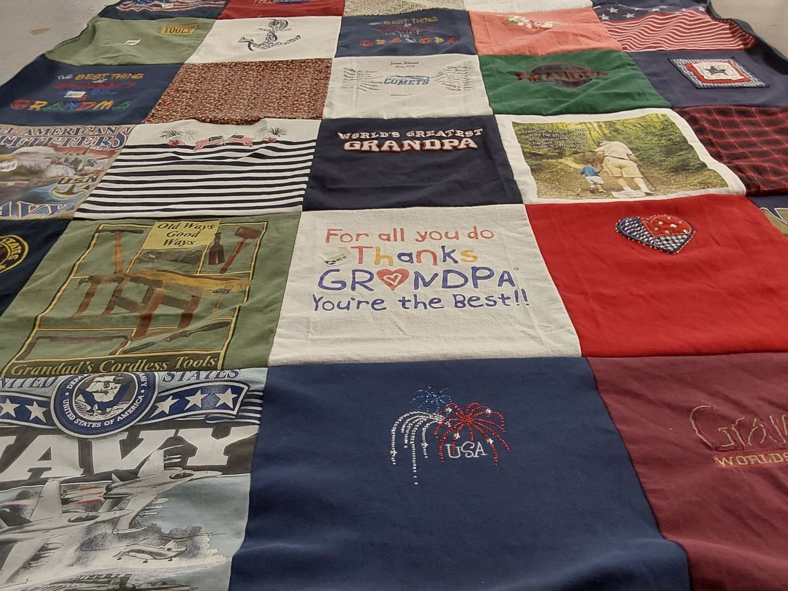 T-shirt quilt with family themes by Lynda from OH