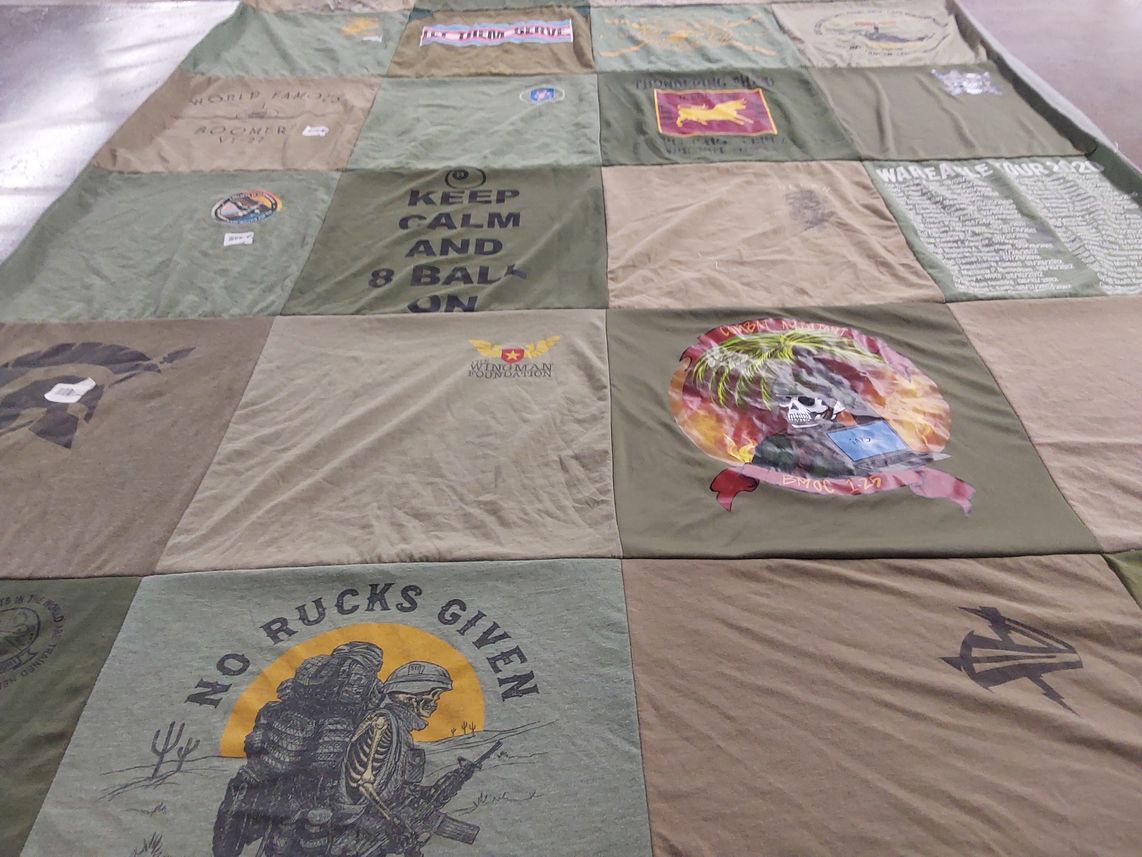 T-shirt quilt with military, travel themes by Simone from CA