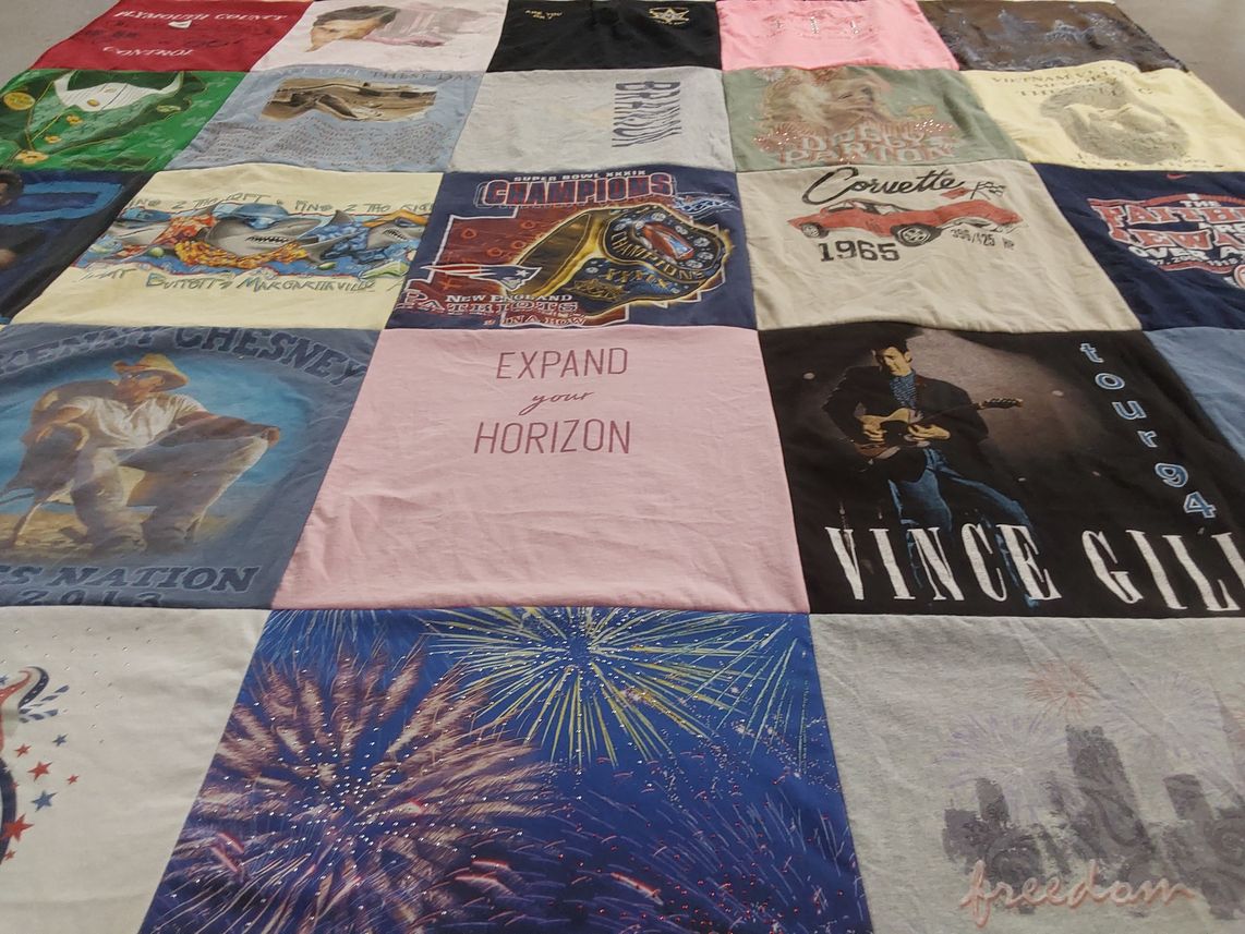 T-shirt quilt with country music themes by Carol from MA