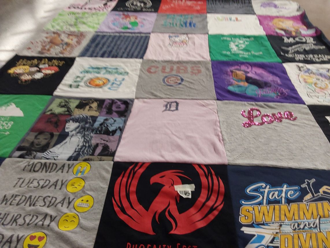 T-shirt quilt with sports, swimming themes by Amy from NC