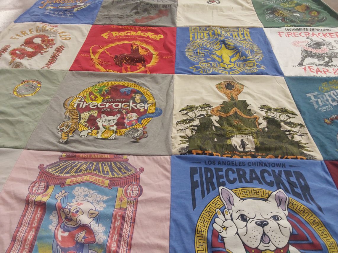 T-shirt quilt with chinatown, cultural events themes by suzanne from CA