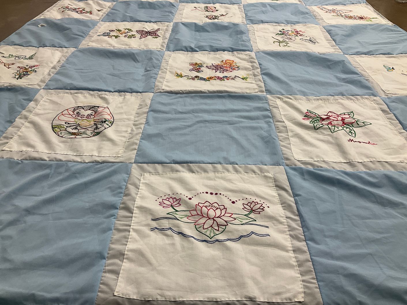 T-shirt quilt with embroidery, flowers themes by Barb from WV