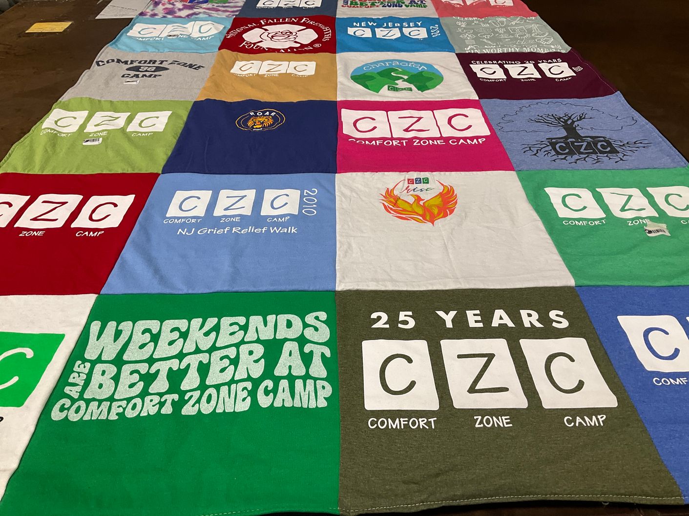 T-shirt quilt with camping, outdoor activities themes by Alexis from VA