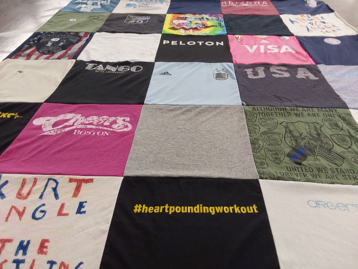 T-shirt quilt with fitness, wrestling themes by Ingrid from NJ