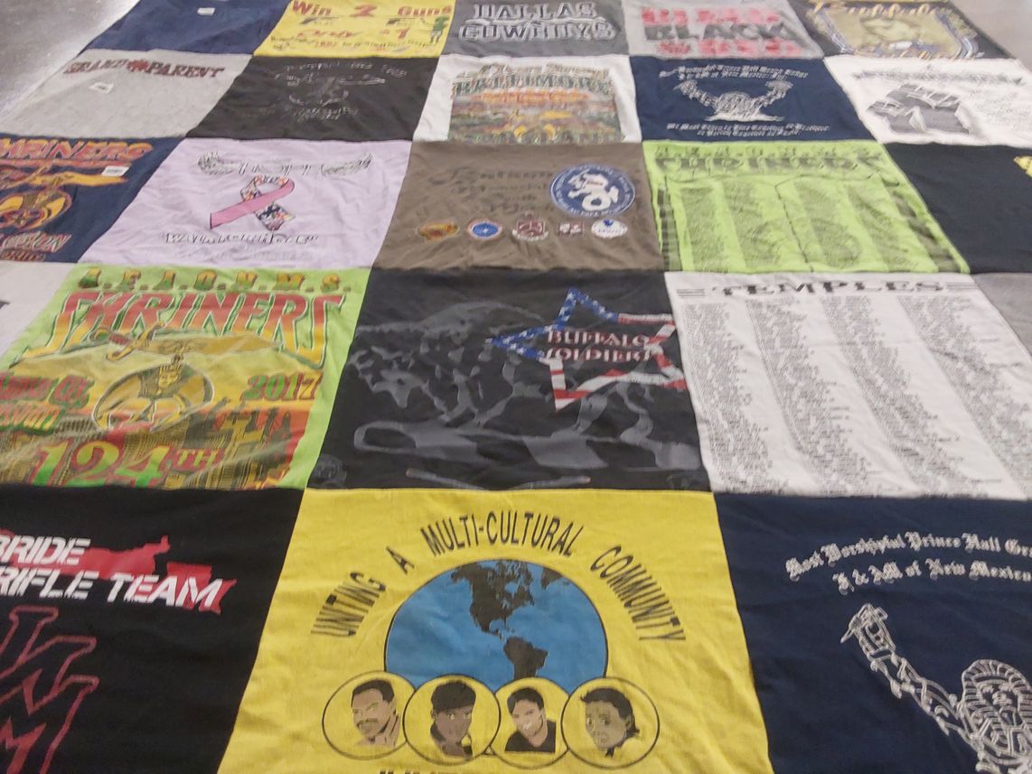 T-shirt quilt with community, multicultural themes by Carmen from NM