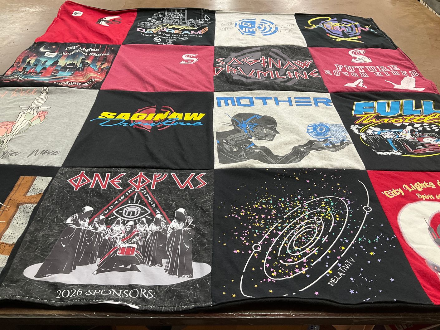 T-shirt quilt with music, art themes by Lindsey from TX