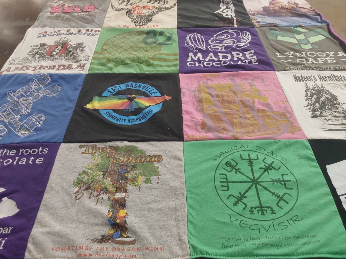T-shirt quilt with community acupuncture, local businesses themes by Jessica from TX