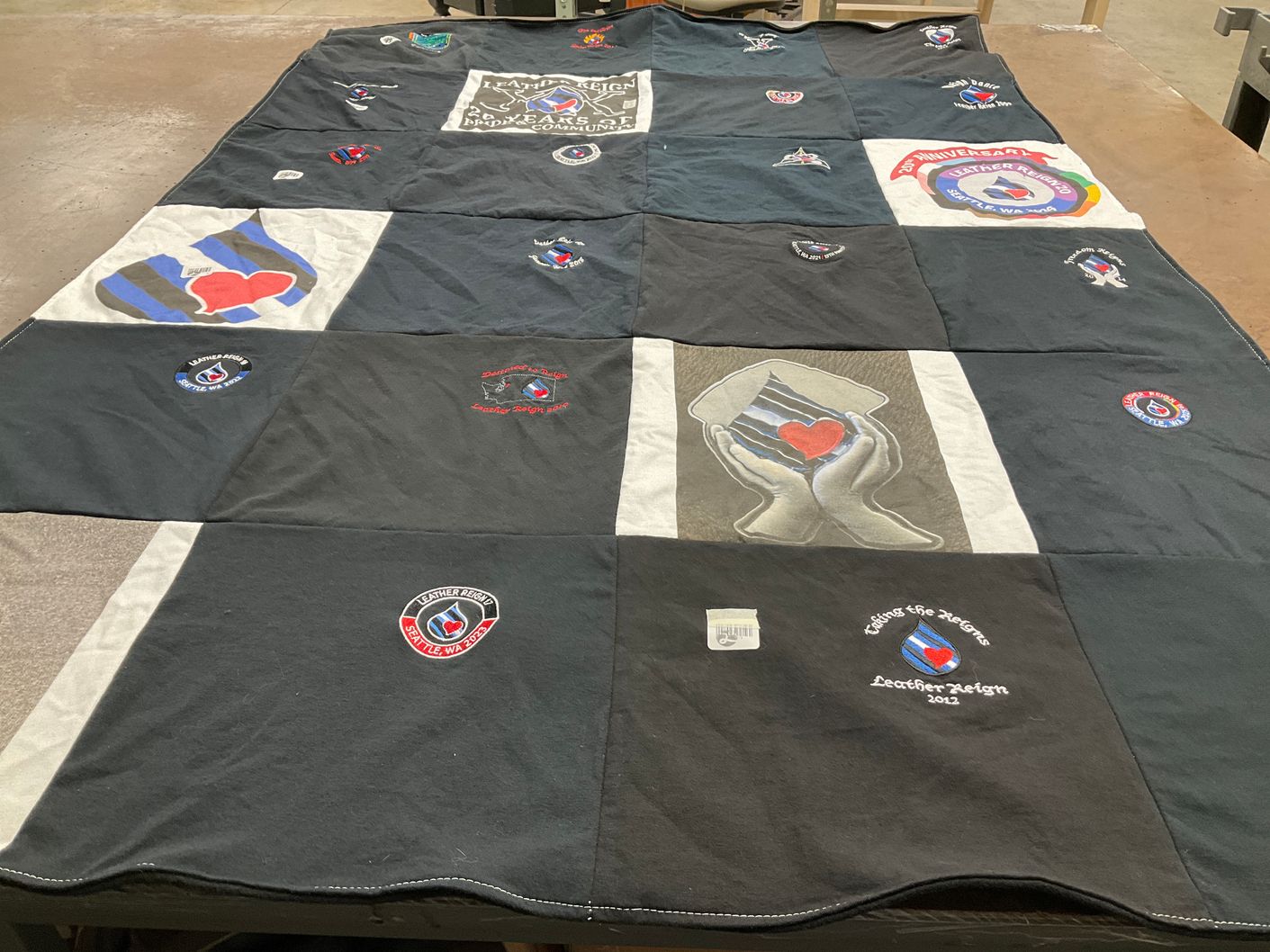 T-shirt quilt with community, support themes by Ann from WA