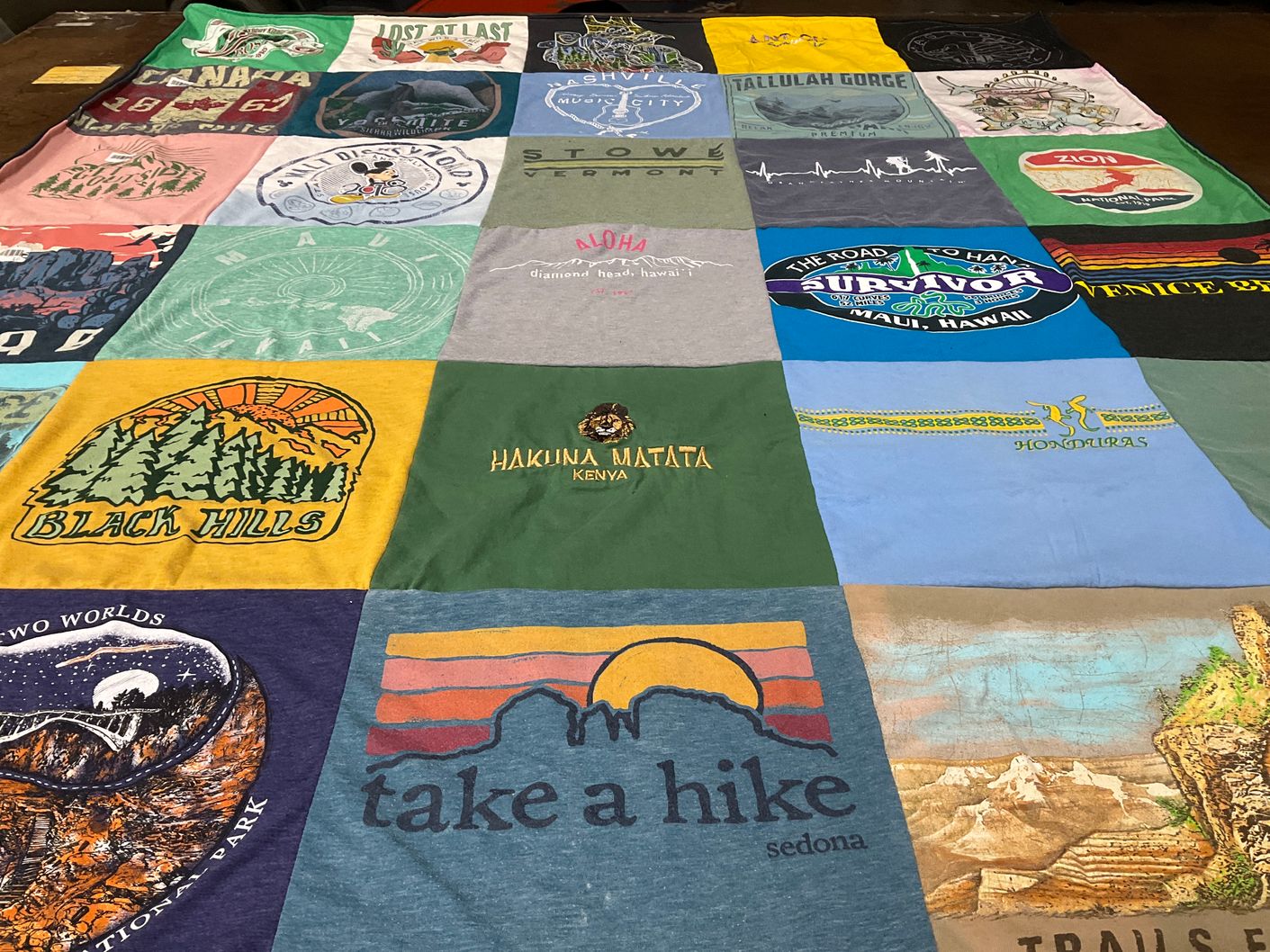 T-shirt quilt with travel, hiking themes by Mary from GA